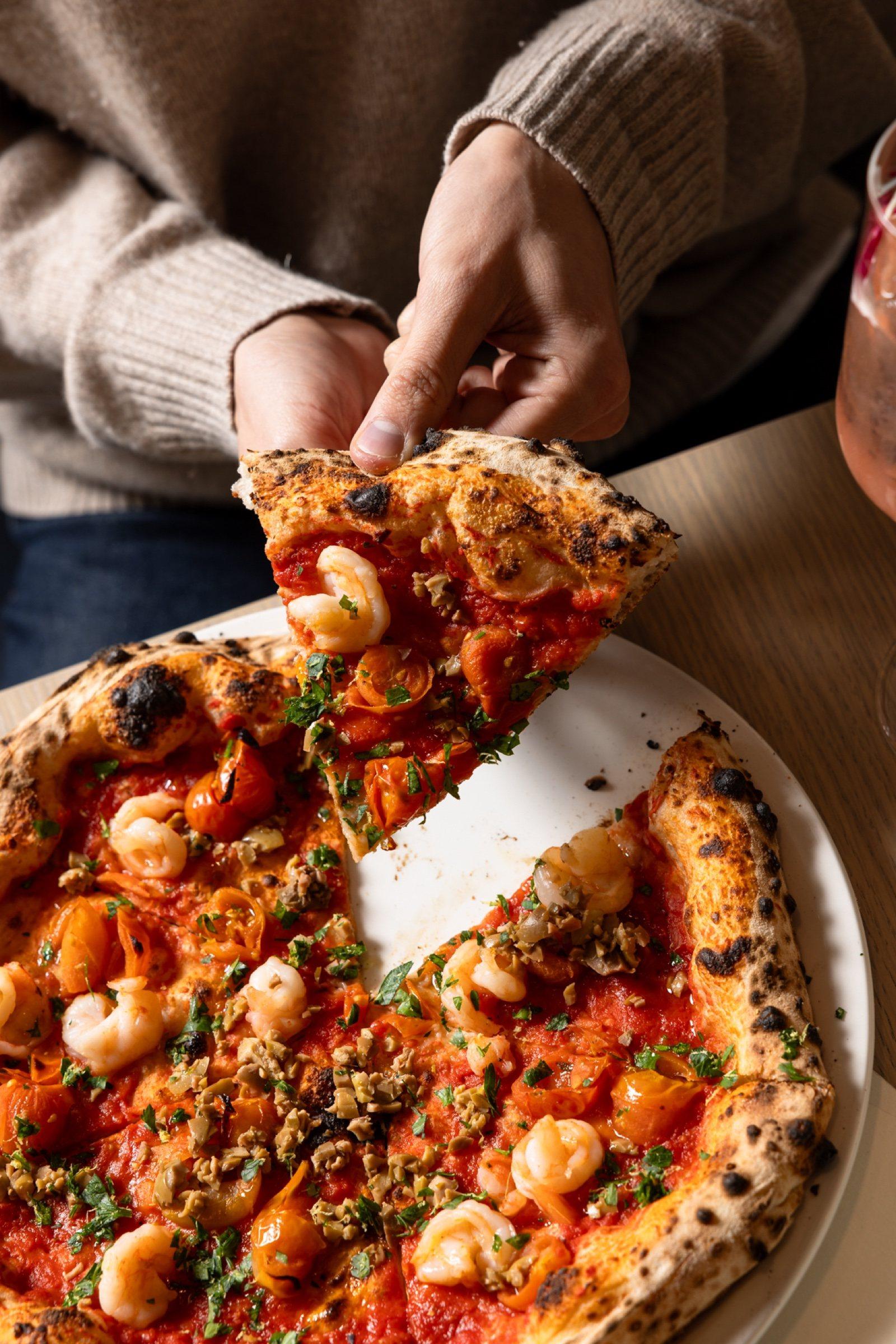 Pulling apart a woodfired pizza at The Observatory