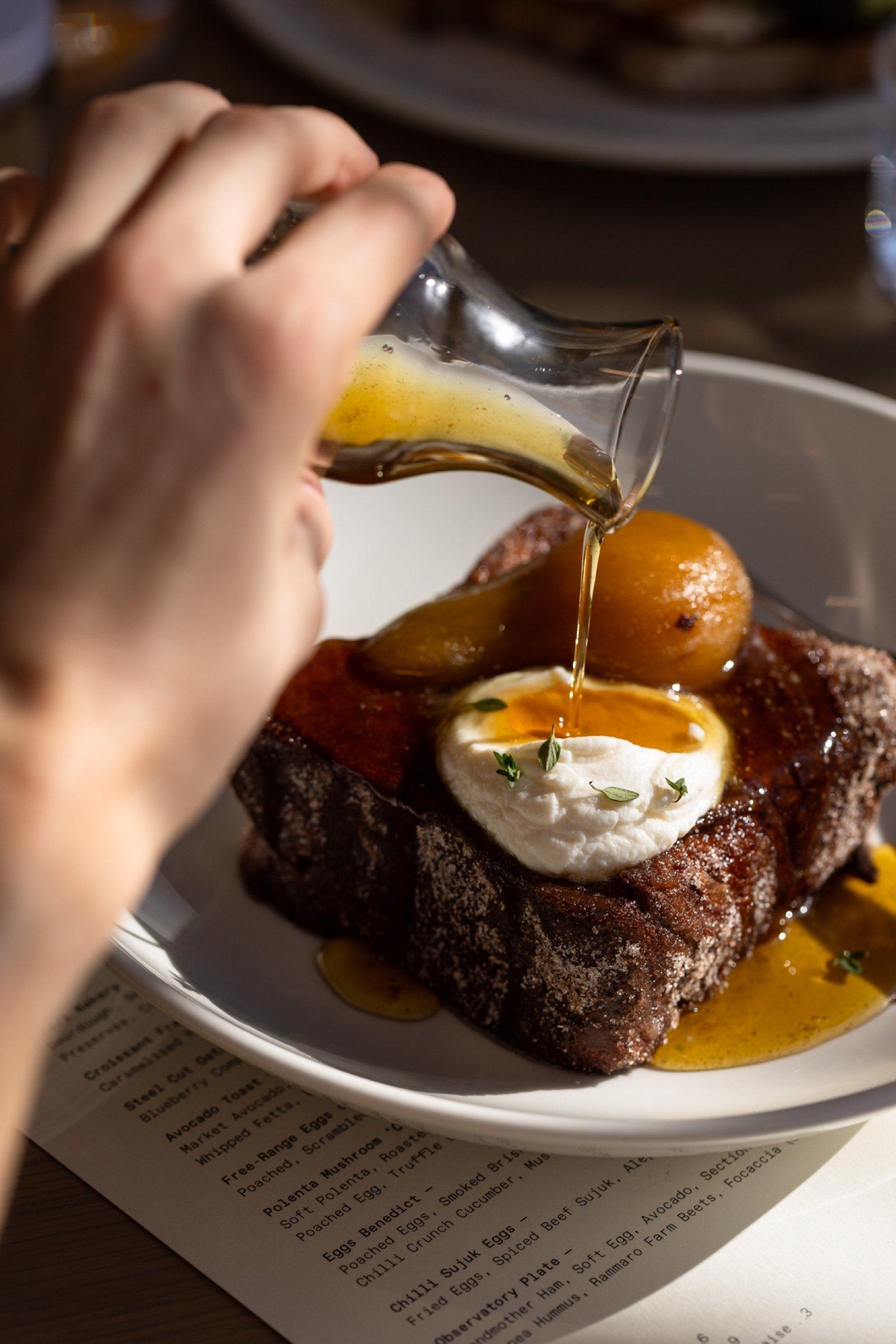 Sauce poured over a main course at The Observatory