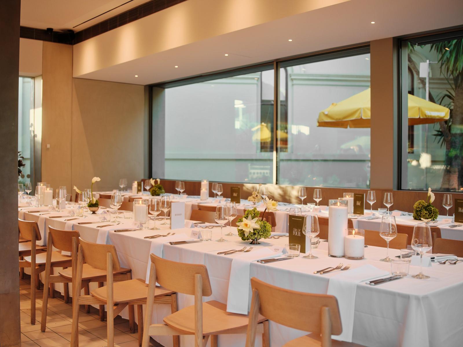 Long tables set along the windows of The Observatory dining room