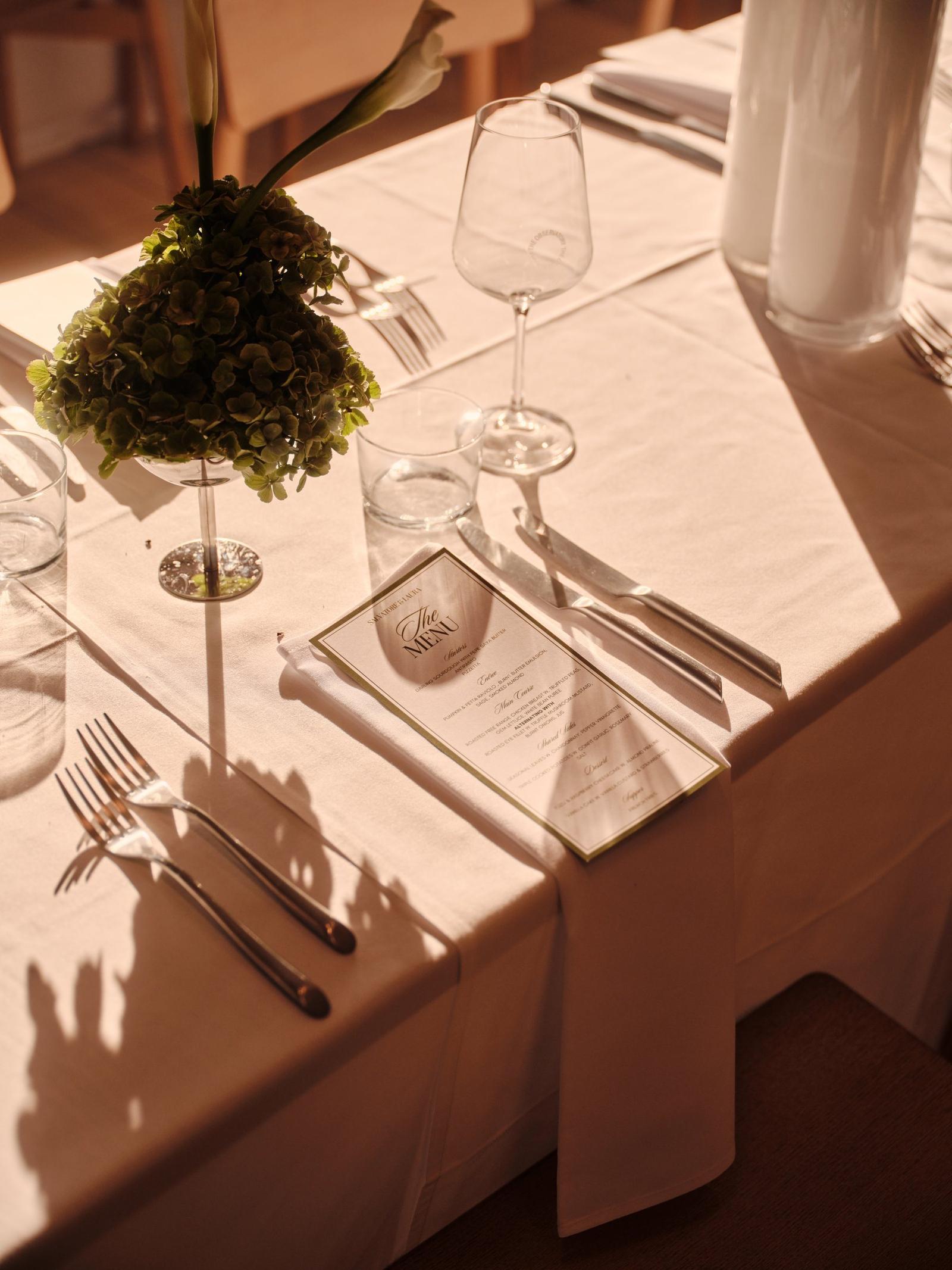Golden-hour light across a set table at an Observatory event