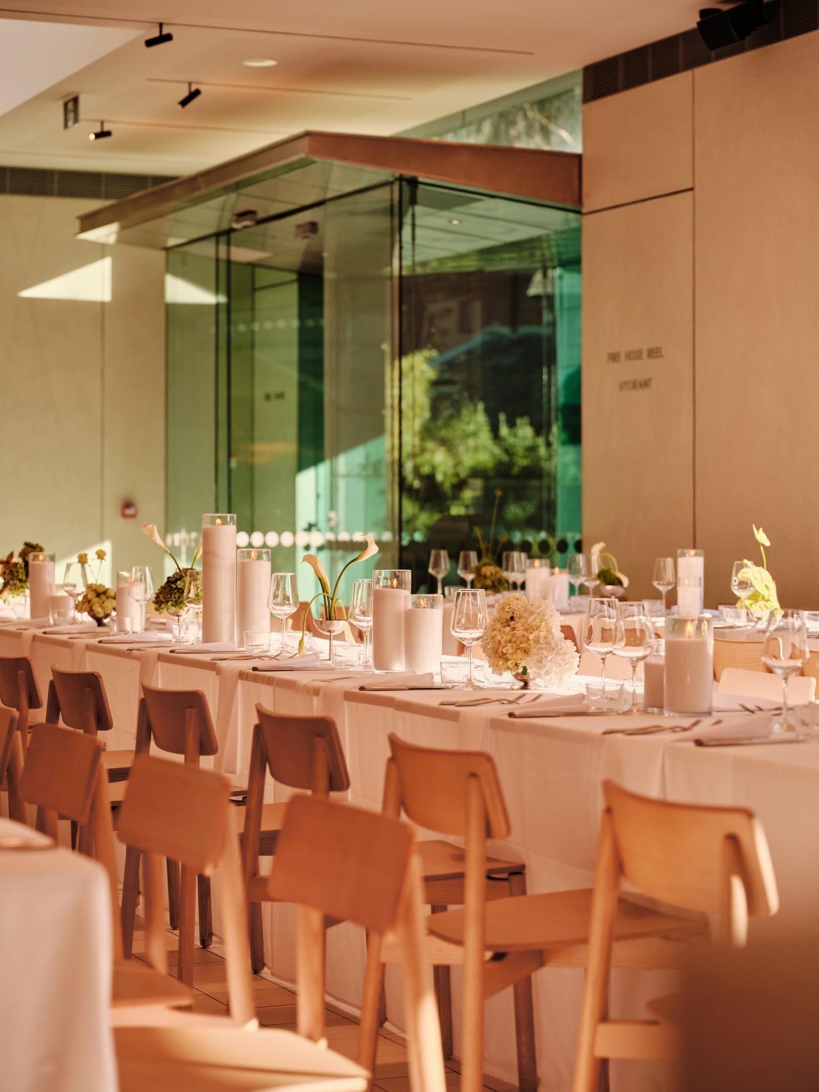 Long tables set for an evening event in The Observatory dining room