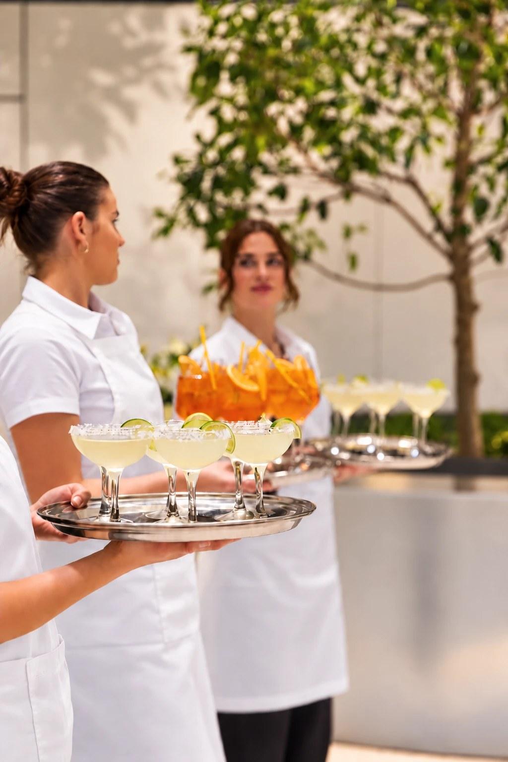 Staff serving margaritas and spritz at an event at The Observatory