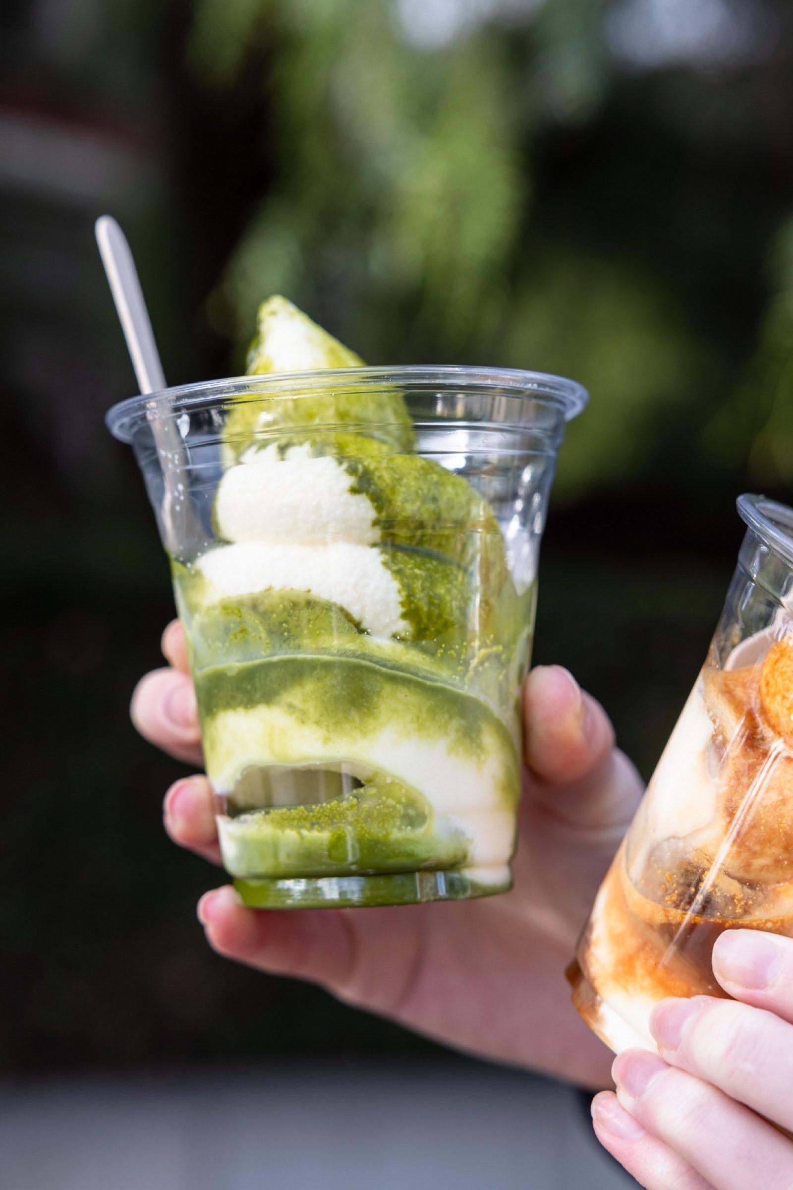 Gelato cups held up in the gardens at The Observatory