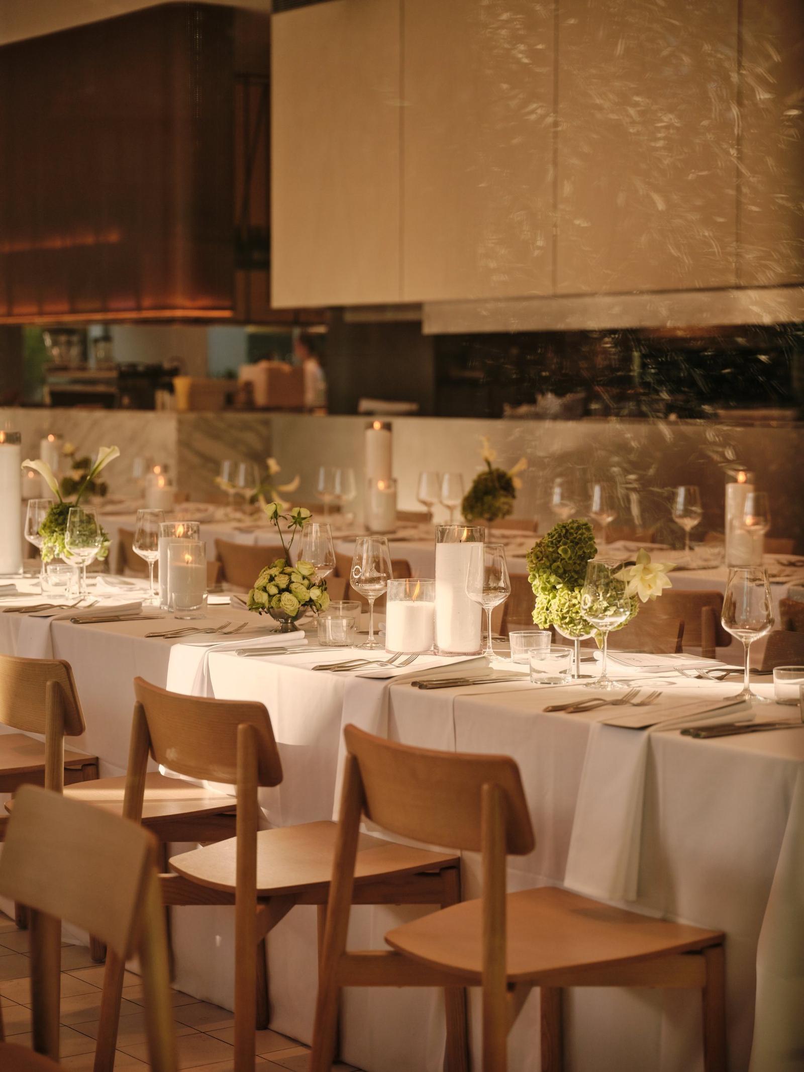 Long tables set beneath the gold-lit canopy at The Observatory